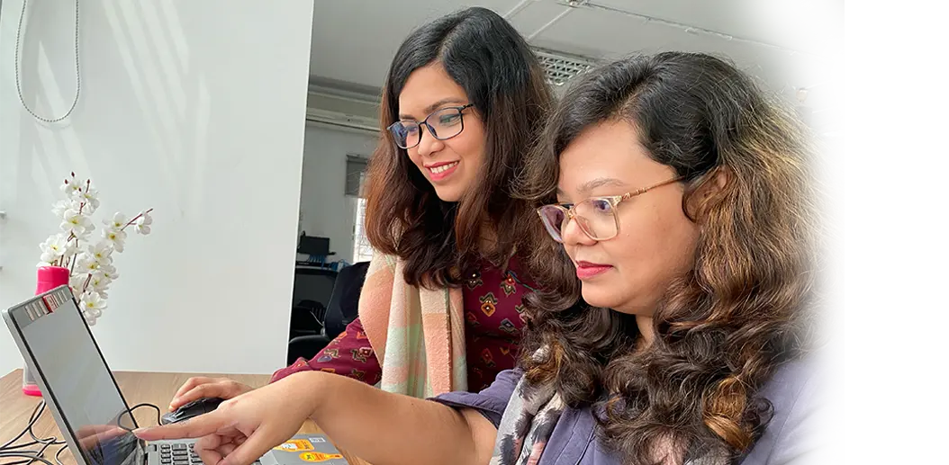 A person engaged in learning at a computer, symbolizing opportunities for personal and professional growth.